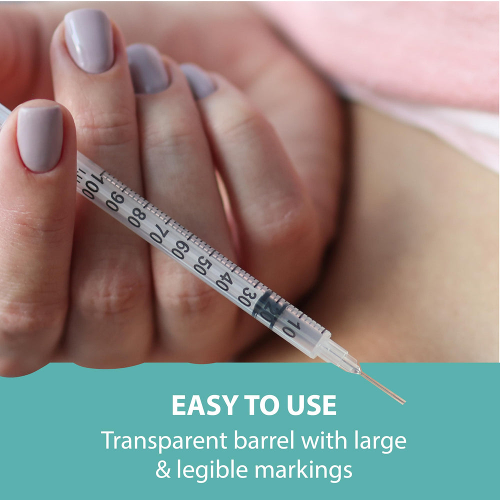 TRUEplus syringe held in hand for size comparison showing compact 5/16 inch needle length