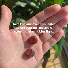 TruHeight two gummies in hand displaying suggested single dose size