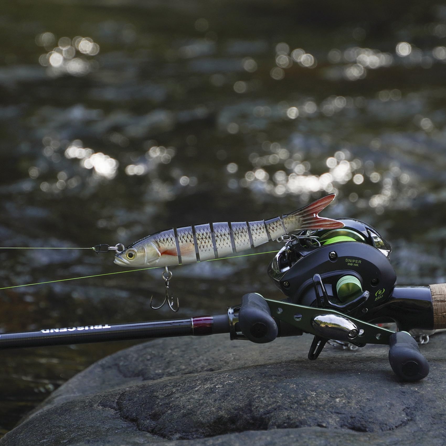 TRUSCEND Swimmax lifestyle image with angler landing fish, showing family-friendly success