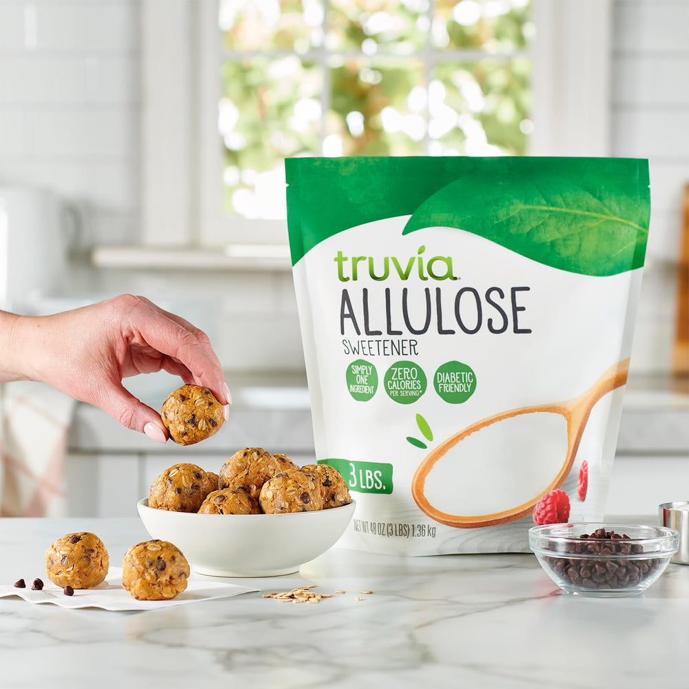 Truvia allulose dissolving in a steaming coffee mug, sweetens without added calories