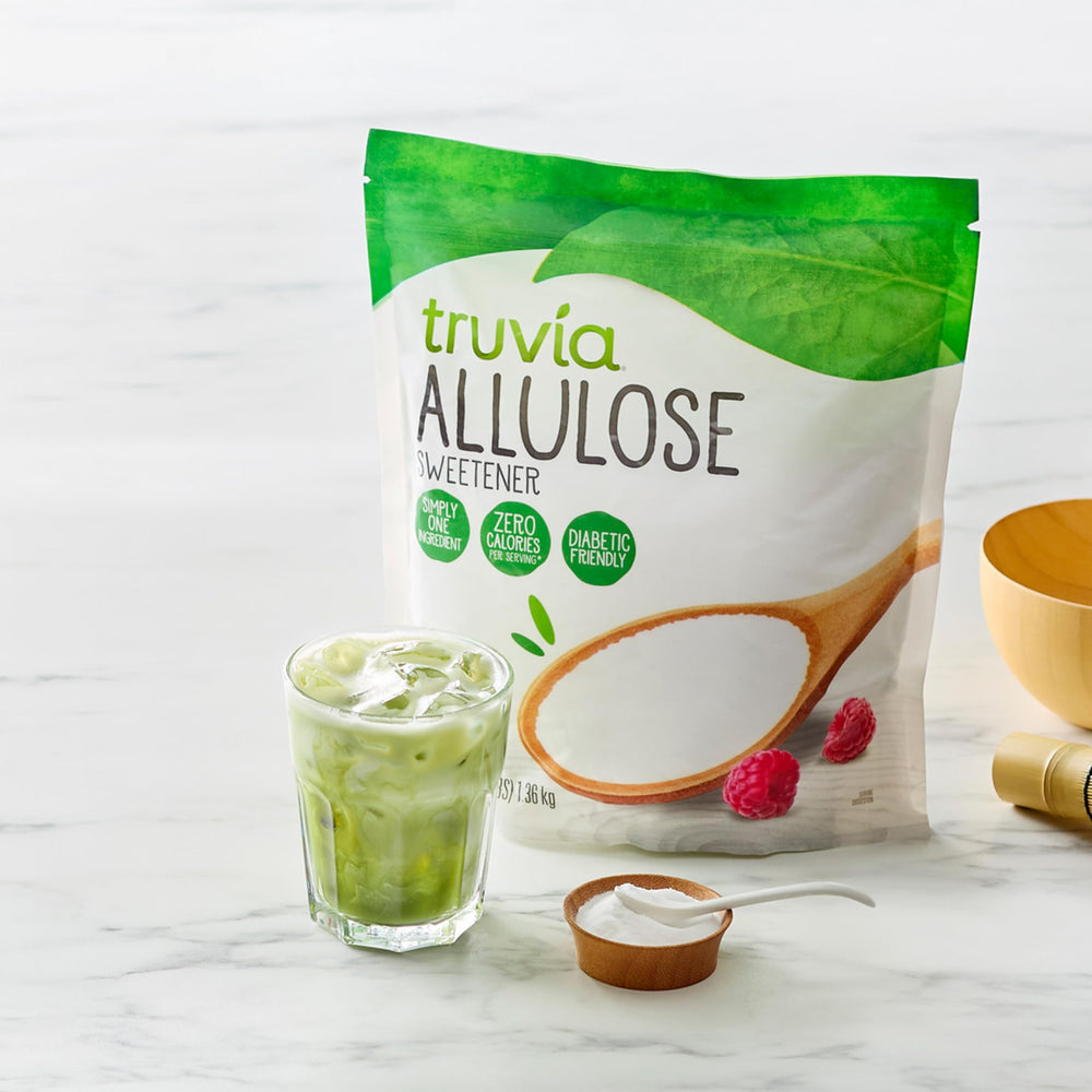 Measuring scoop of Truvia allulose being leveled, convenient portioning for recipes