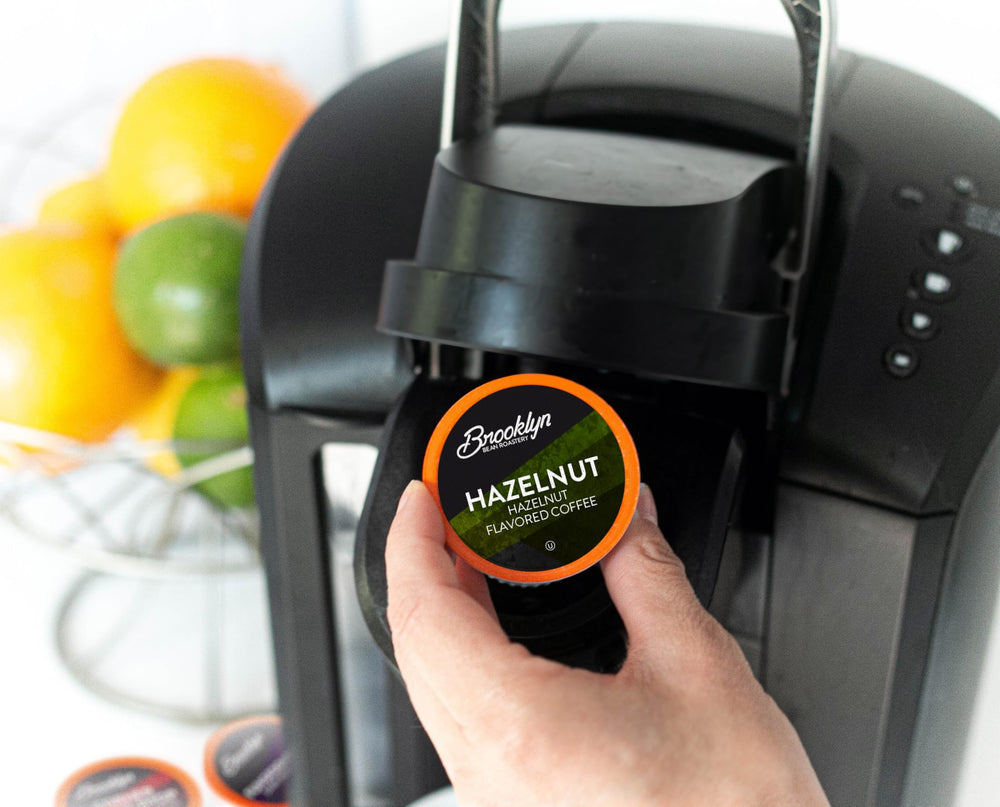 Two Rivers Coffee pod brewing in Keurig machine for fast single-cup convenience