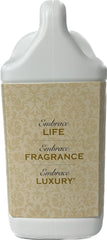 TYLER CANDLE COMPANY gallon next to folded towel to show size and long-lasting value