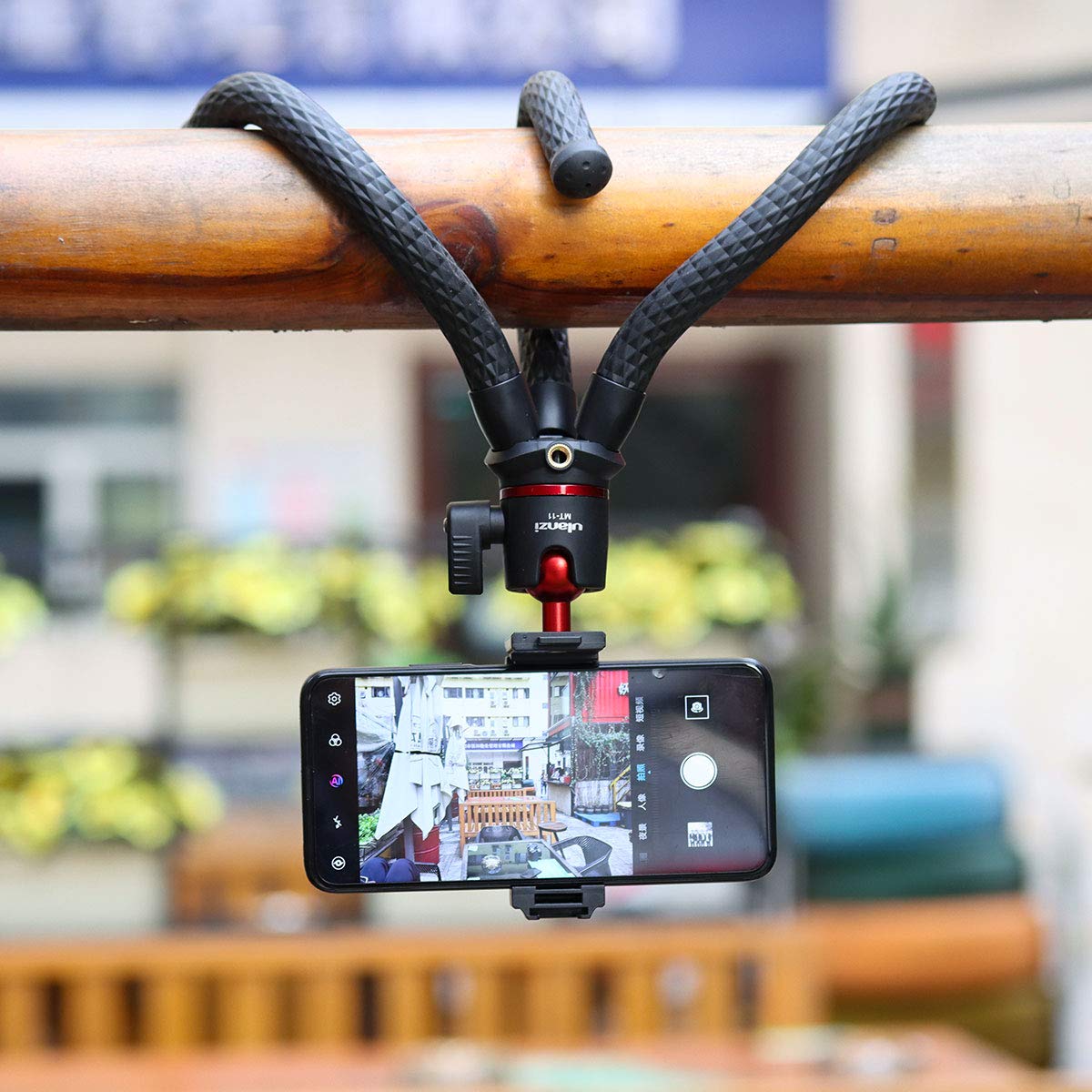 ULANZI tripod next to a smartphone to show scale and travel convenience