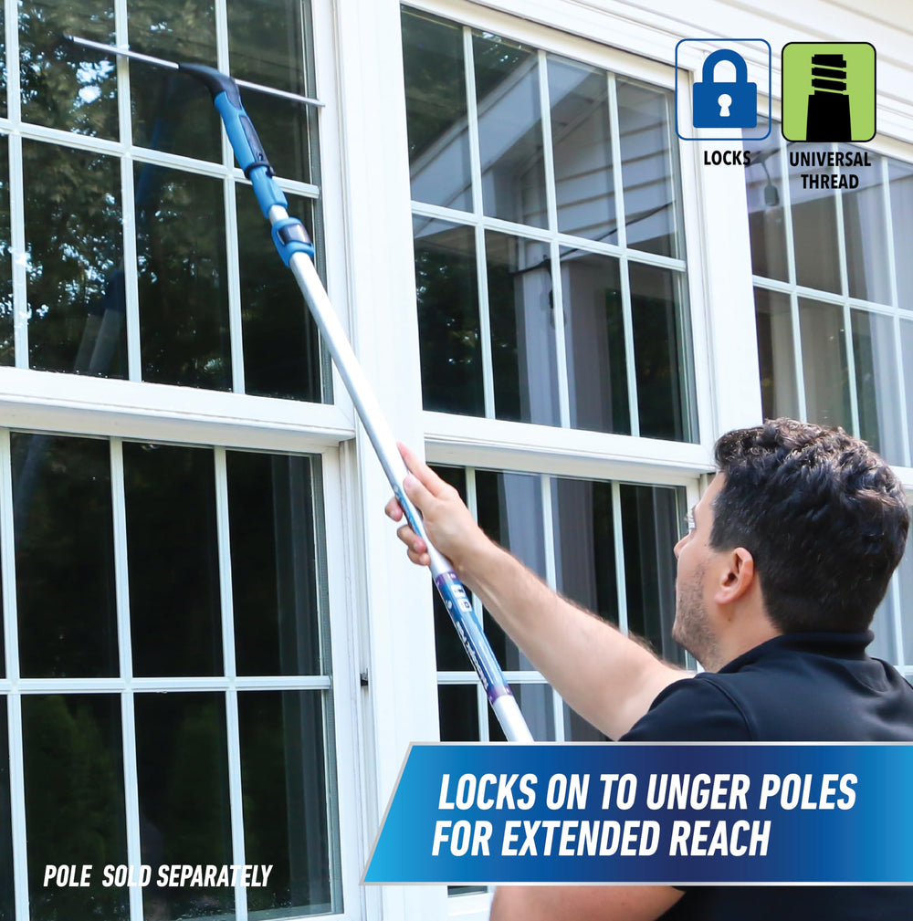 UNGER squeegee mounted on telescopic pole for safe high-window reach and control