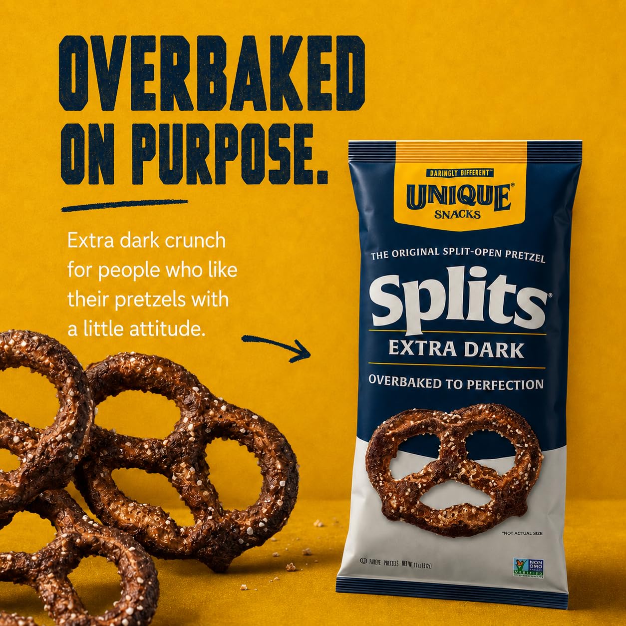 Unique Snacks pretzel in hand for scale demonstrating sizable crunchy split and snackability