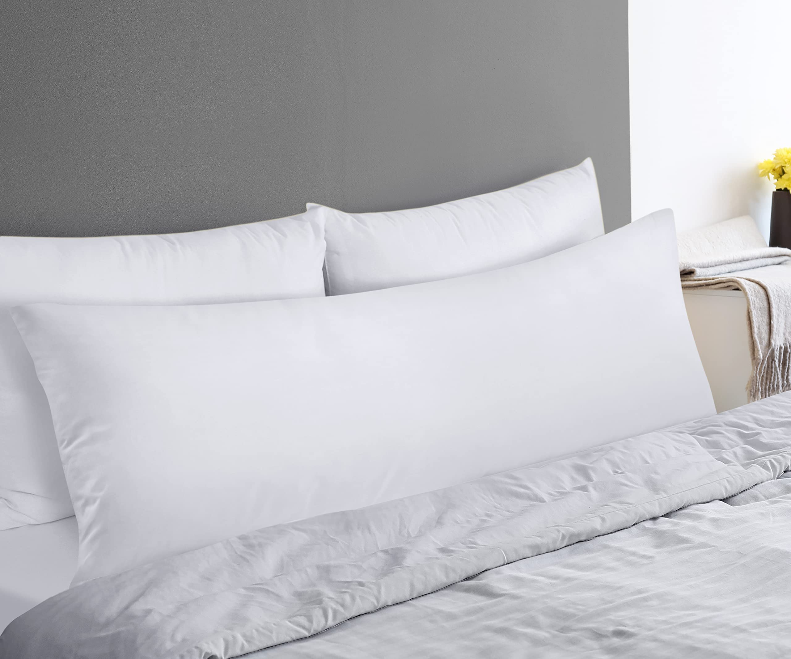 Utopia Bedding pillow next to ruler for size comparison illustrating 20 by 54 inches coverage
