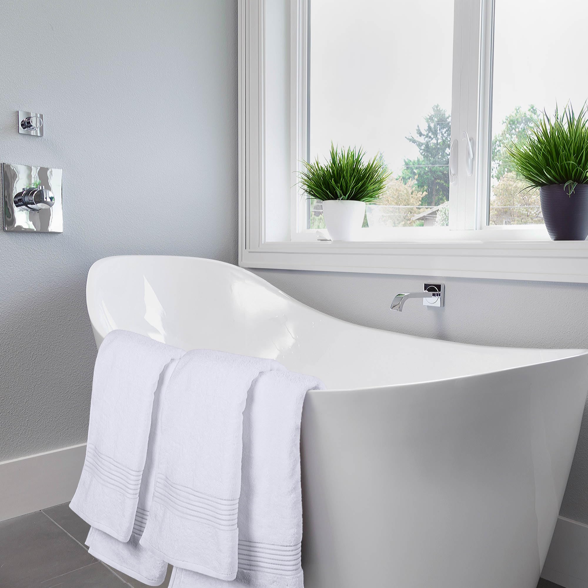 Utopia Towels placed poolside showing quick drying and versatile use for spa or outdoor settings