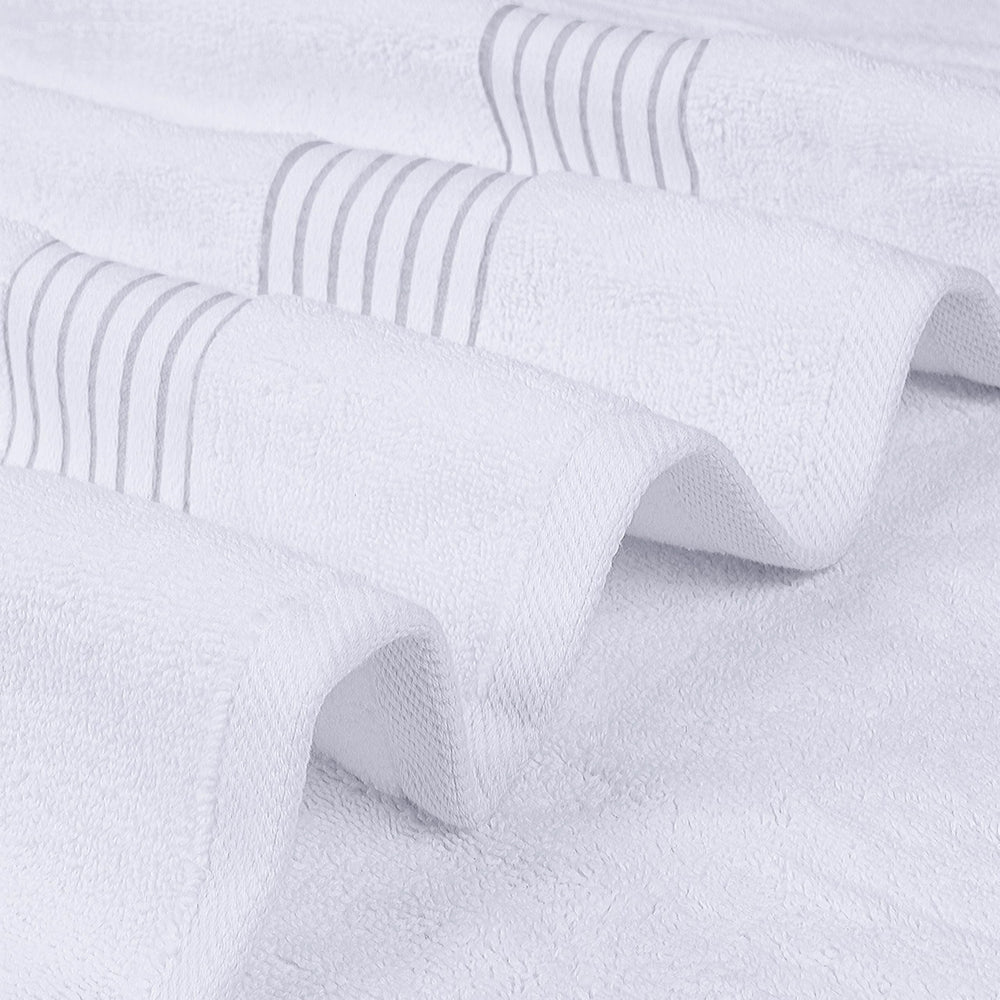 Utopia Towels folded stack on bathroom shelf demonstrating tidy storage and easy organization