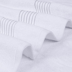 Utopia Towels folded stack on bathroom shelf demonstrating tidy storage and easy organization