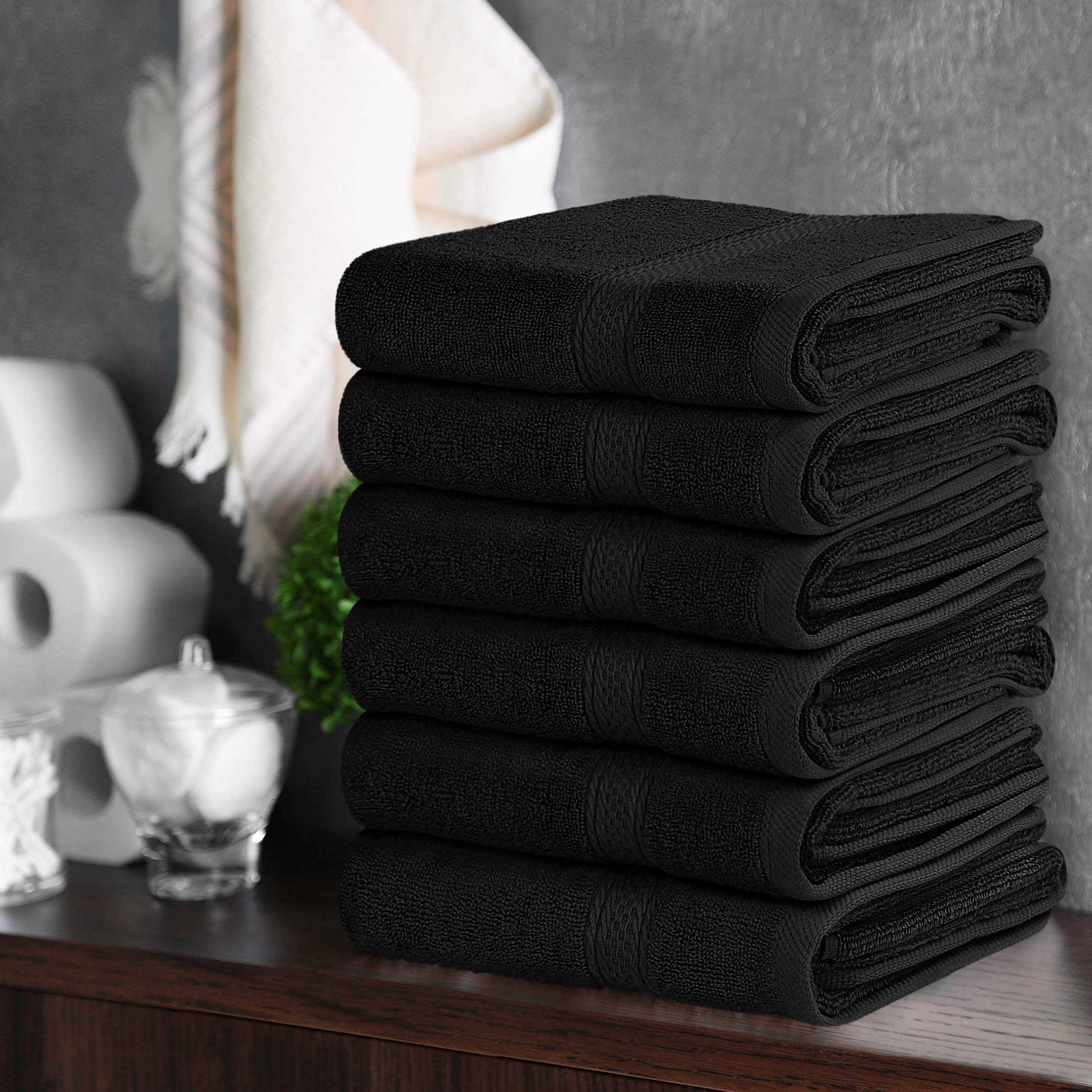 Utopia Towels being used to dry hands at a sink, illustrating everyday absorbent performance