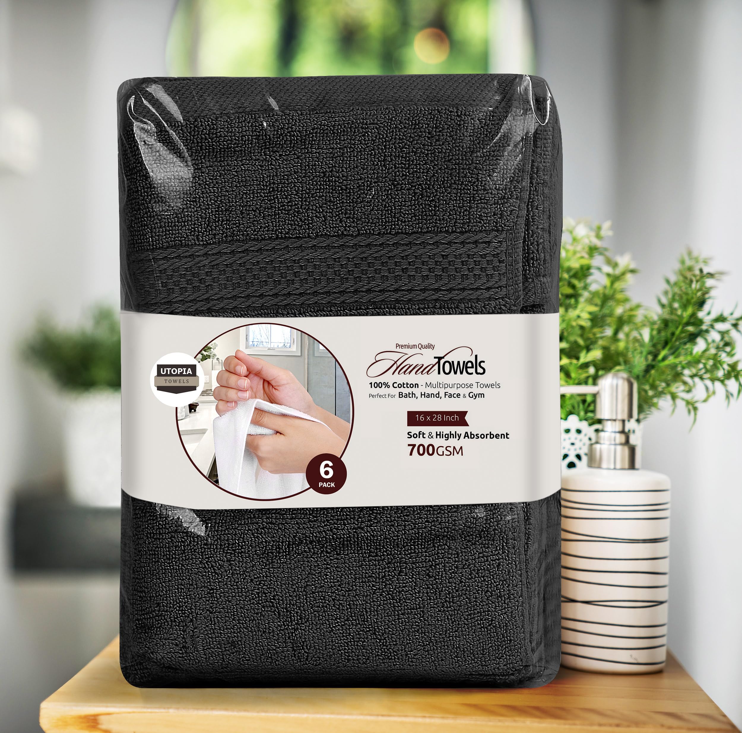 Utopia Towels styled in a modern bathroom setting, complementing black decor and design