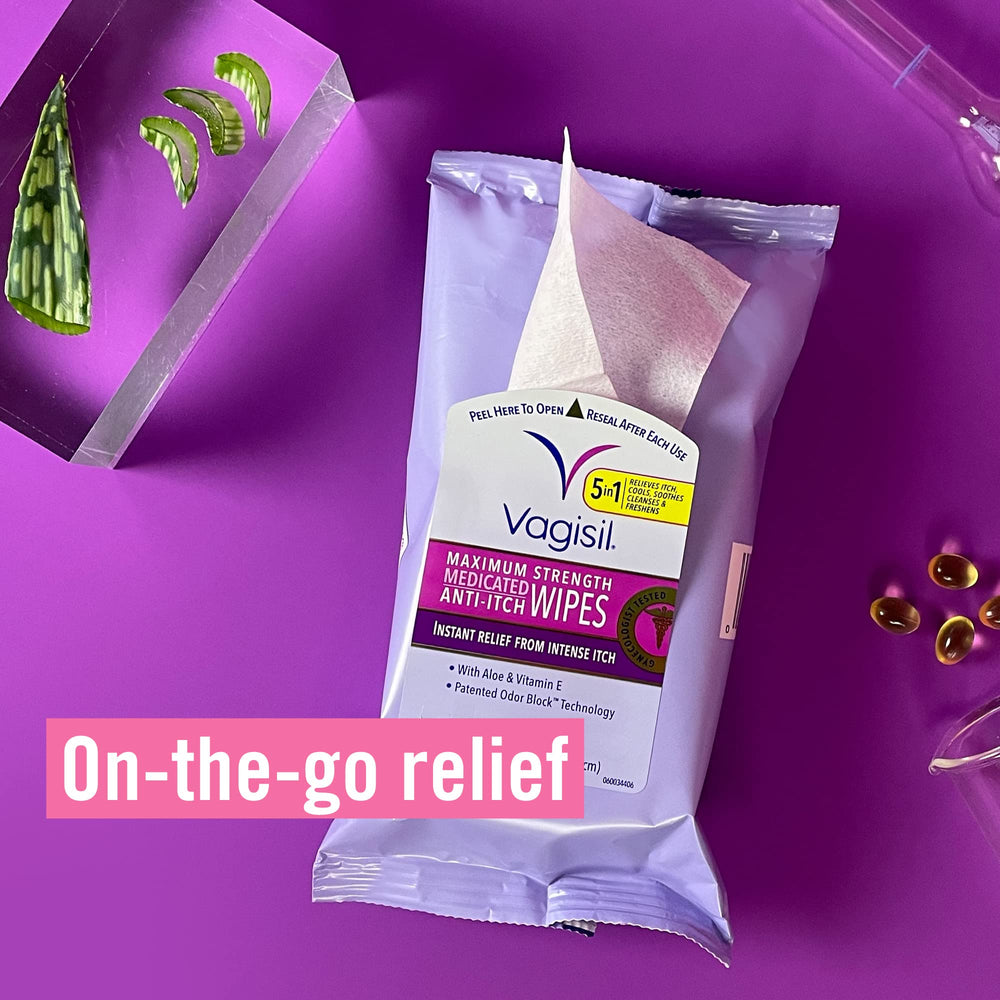 Hand holding Vagisil pack to show pocket-sized convenience benefit