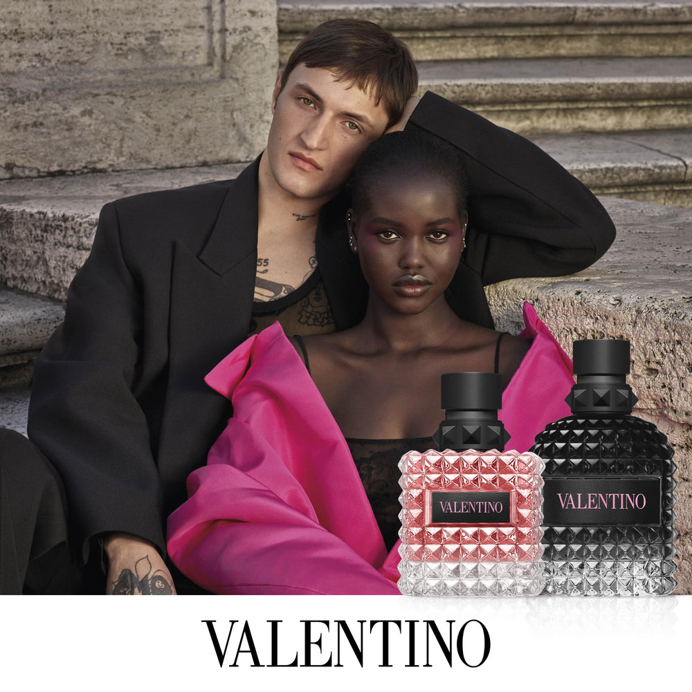 Valentino 3.4 oz bottle next to a wallet for size comparison and portability