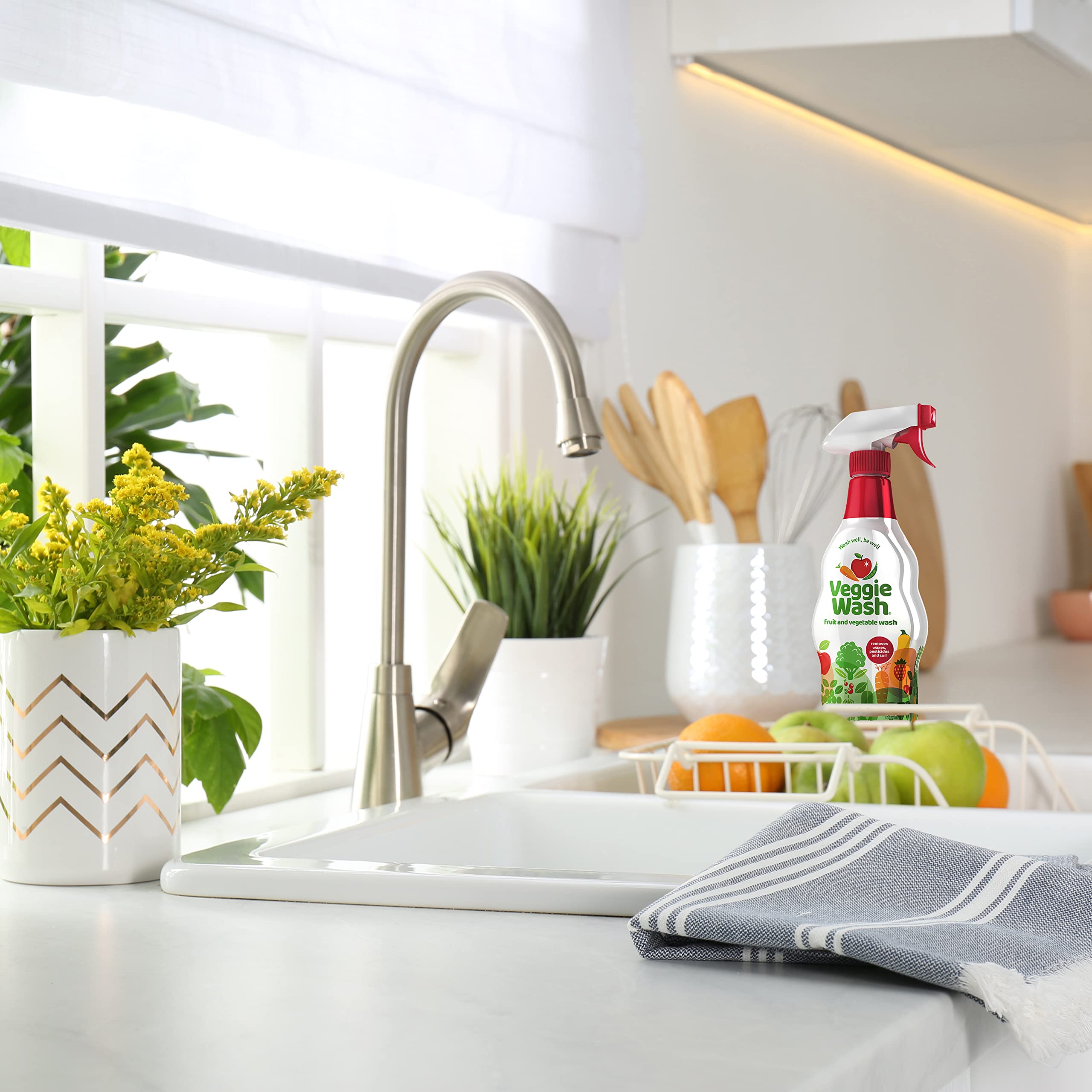 Kitchen scene with Veggie Wash and fresh fruit showing convenience and safety