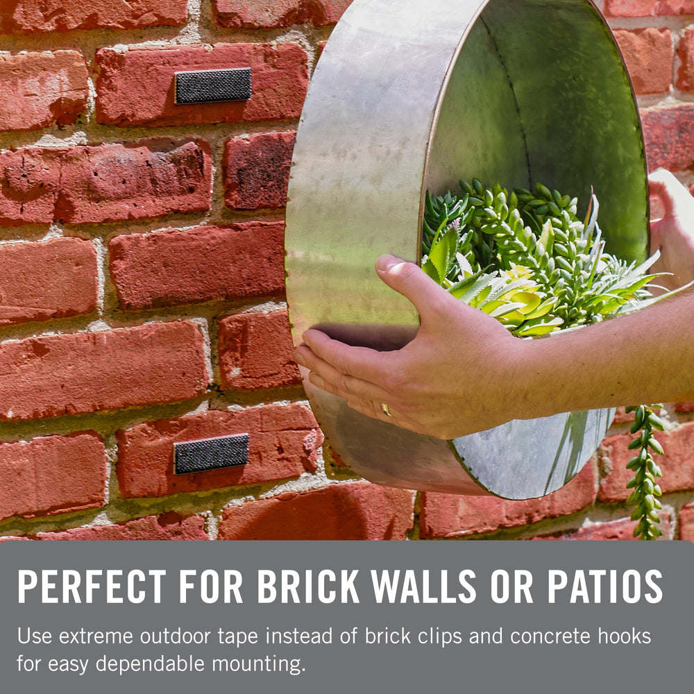 VELCRO Brand tape used to hang an outdoor planter demonstrating secure hold