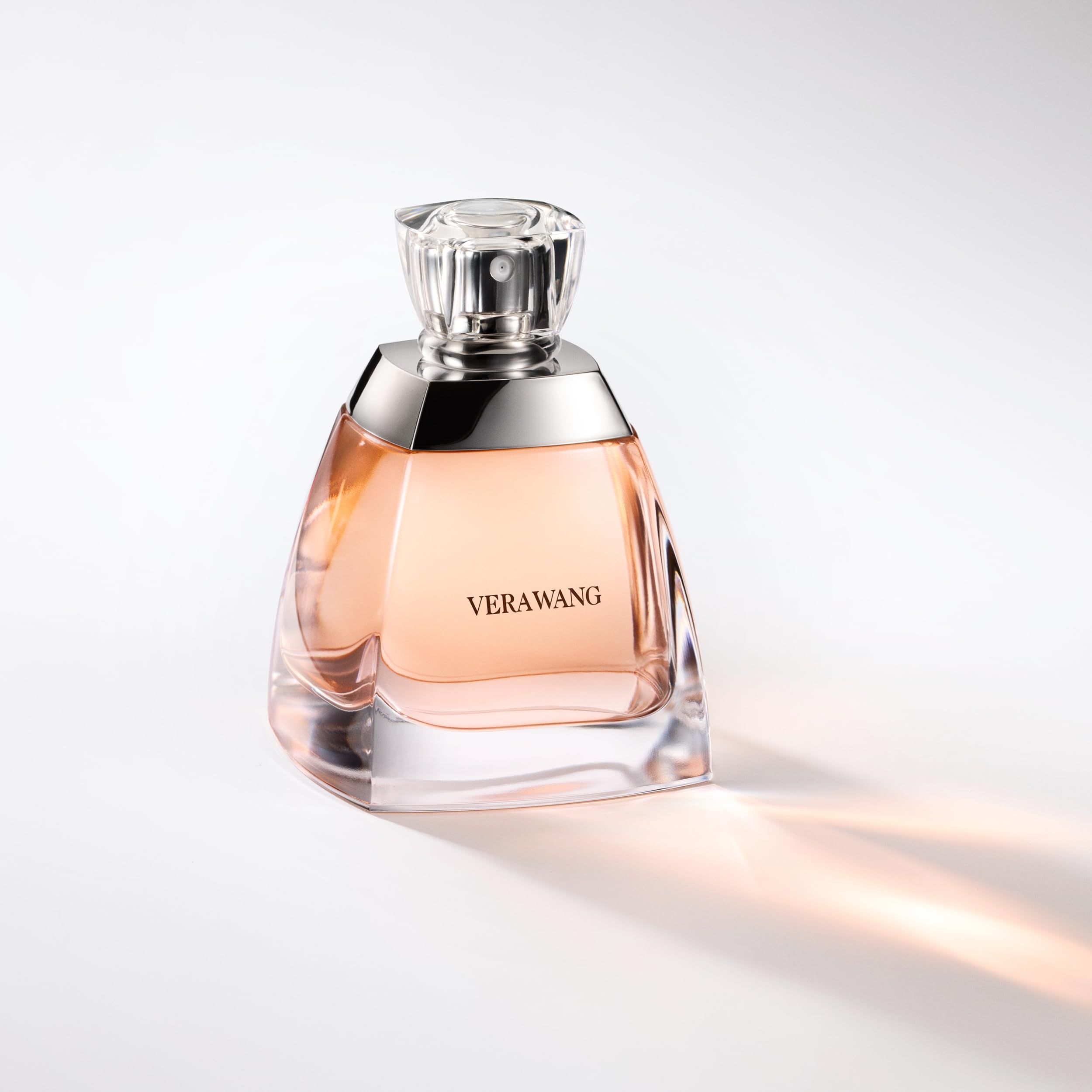 Vera Wang label and cap visible to confirm authentic branding and clarity