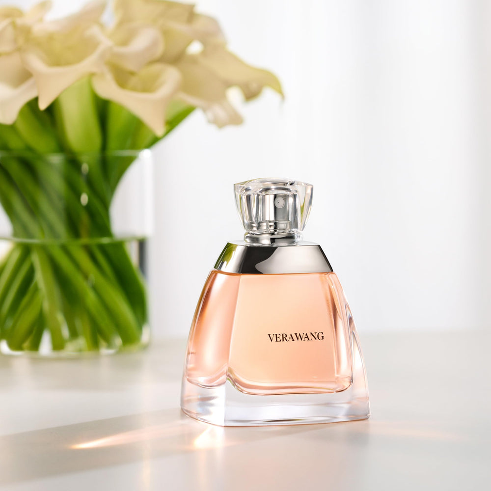 Vera Wang bottle on a dinner table evoking date-night elegance and mood