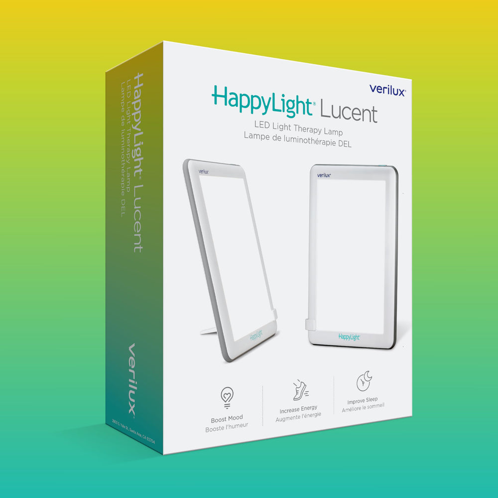 Verilux HappyLight Lucent next to a smartphone to show scale and convenient compact size