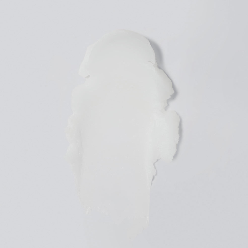 Versed balm open showing smooth solid-to-oil texture for melting makeup
