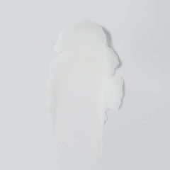 Versed balm open showing smooth solid-to-oil texture for melting makeup