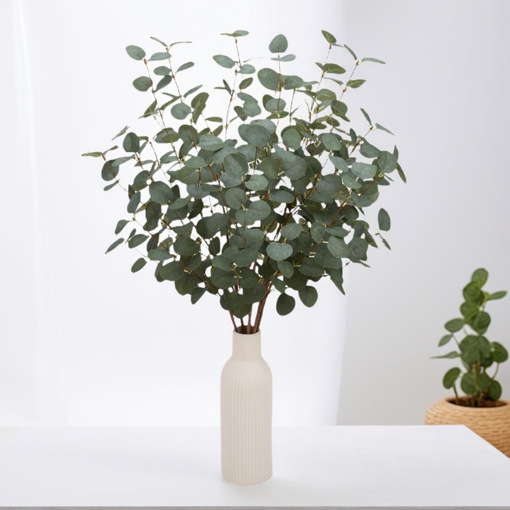 VGIA styled vase centerpiece with eucalyptus stems adding effortless greenery benefit