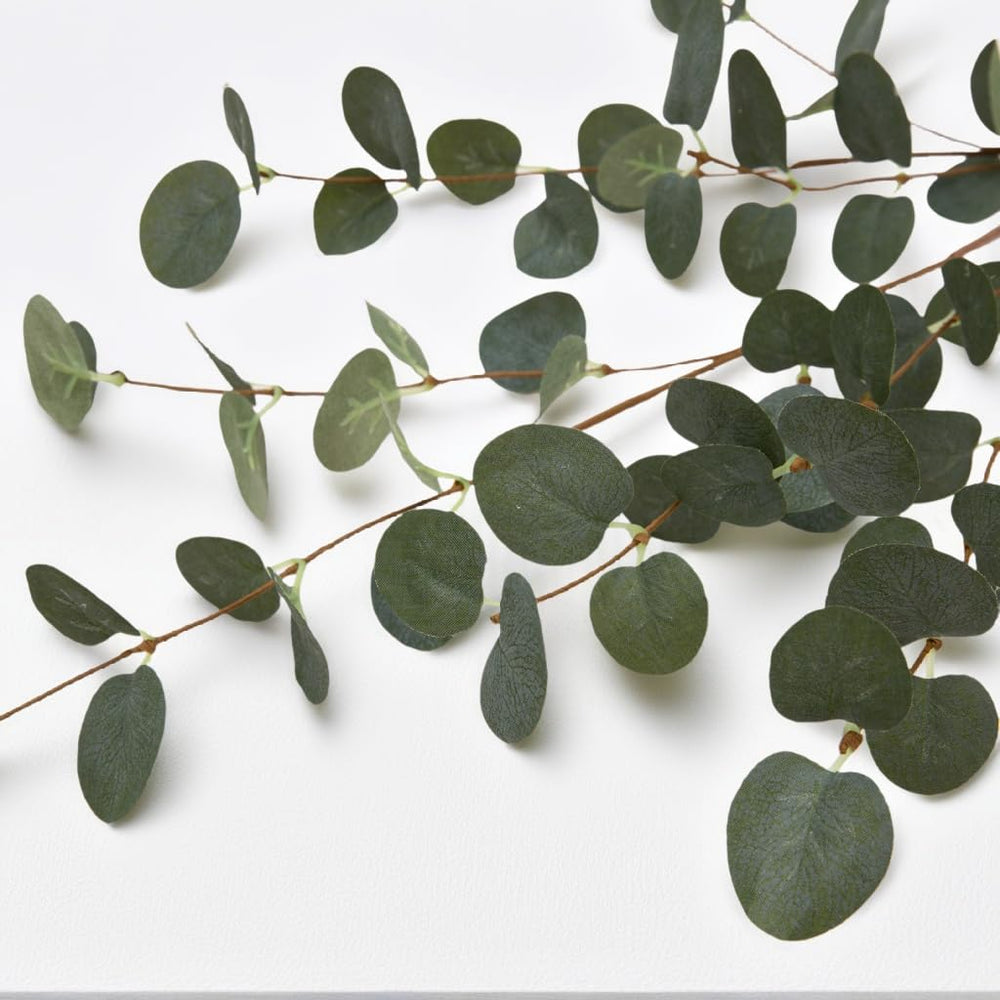 VGIA eucalyptus stems used on a wedding aisle creating lasting greenery without maintenance benefit