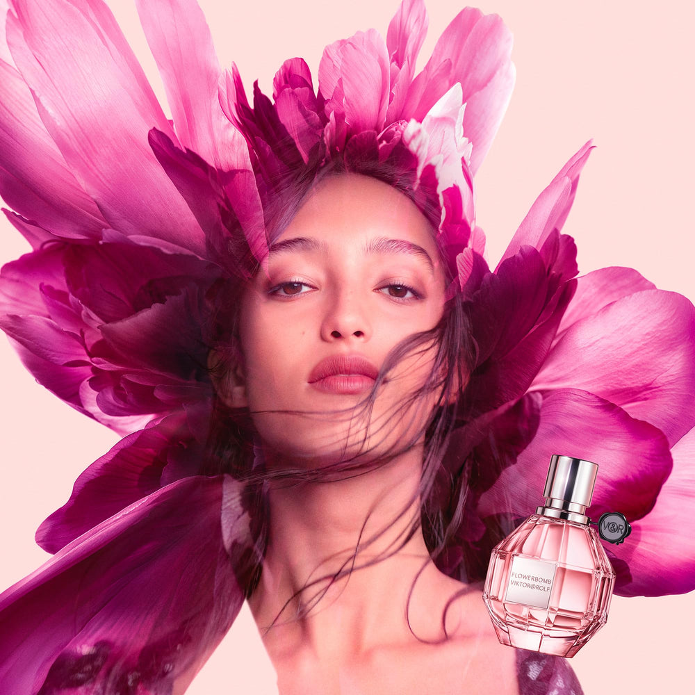 Viktor&Rolf bottle held in hand showing compact size and travel convenience