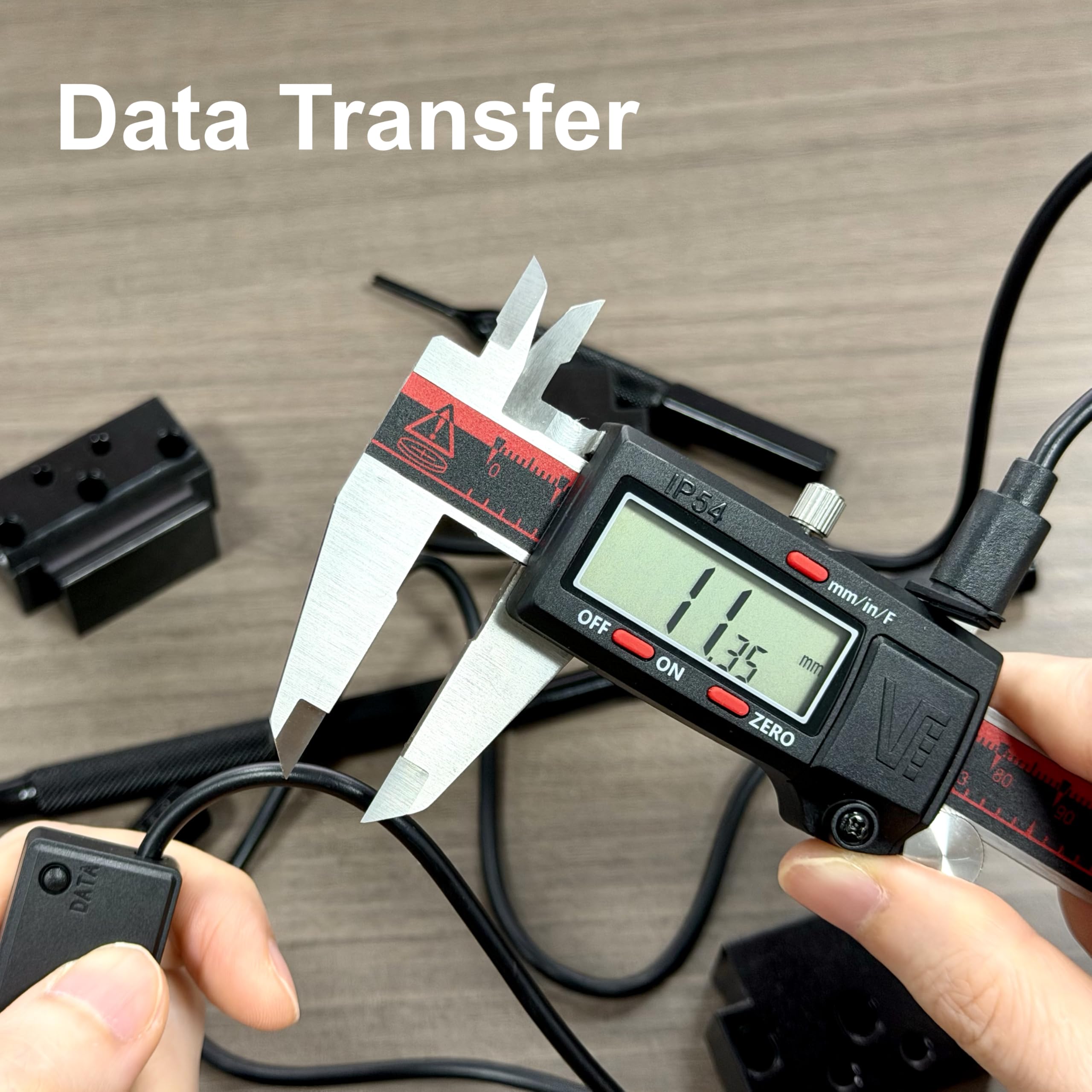 VINCA caliper in hand for scale showing compact size and ergonomic handling benefits