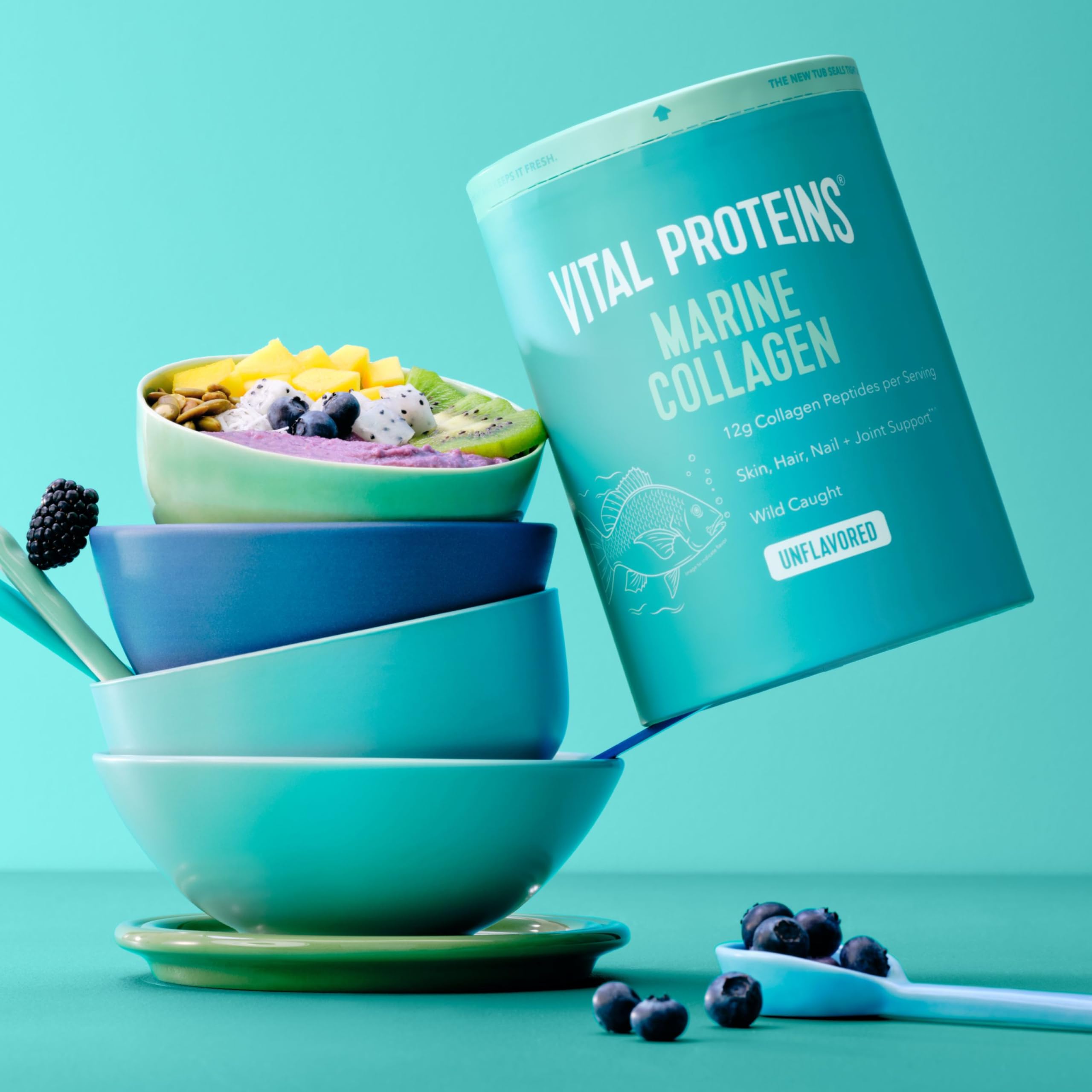Vital Proteins open tub with scoop demonstrating convenient daily serving