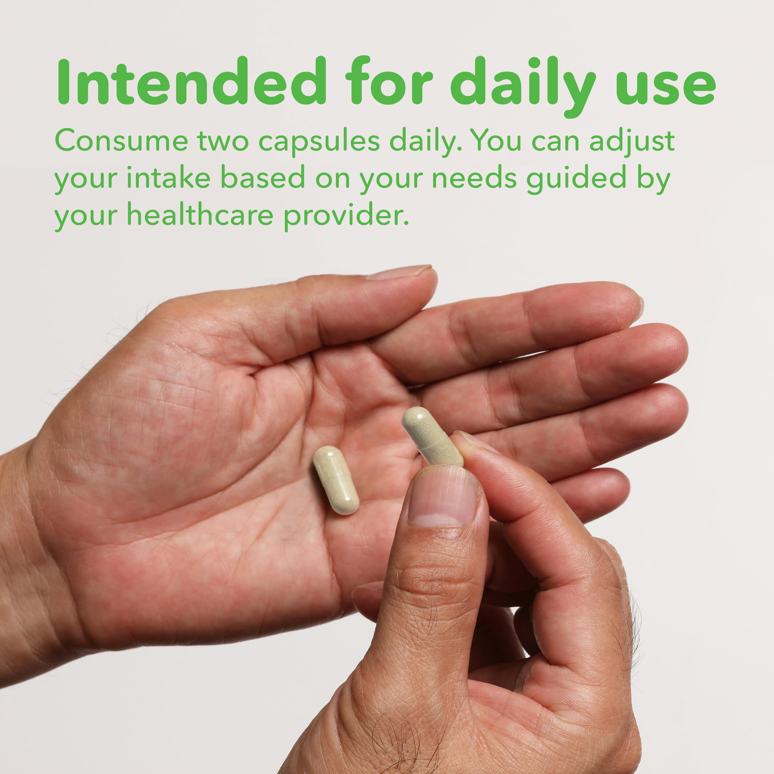 VITASUPPORTMD capsule held in hand in a lifestyle scene implying convenient daily use