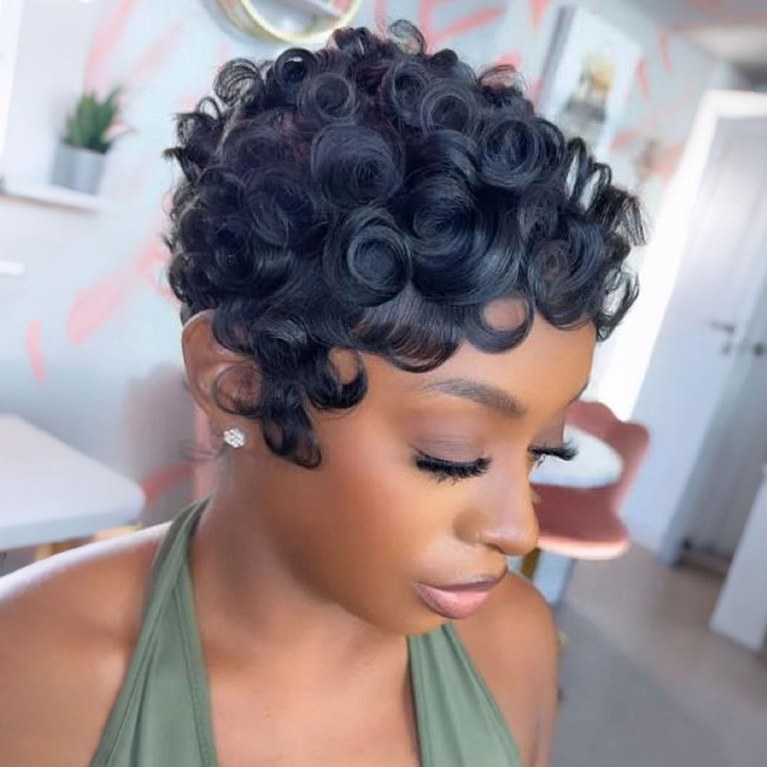 VRZ pixie side profile highlighting short layers and curl definition for flattering silhouette