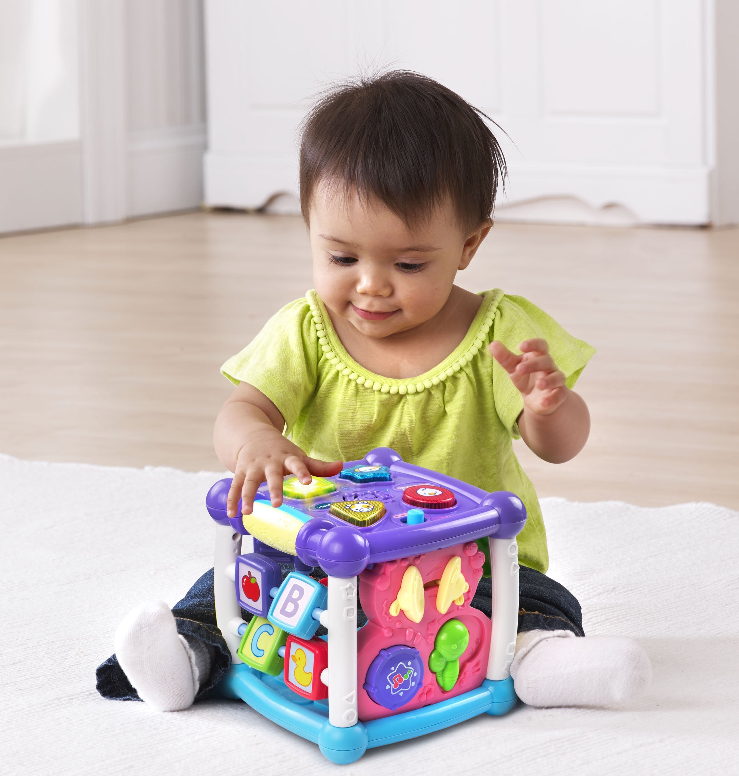 VTech Busy Learners Activity Cube side with sliders and spinners, builds fine motor skills