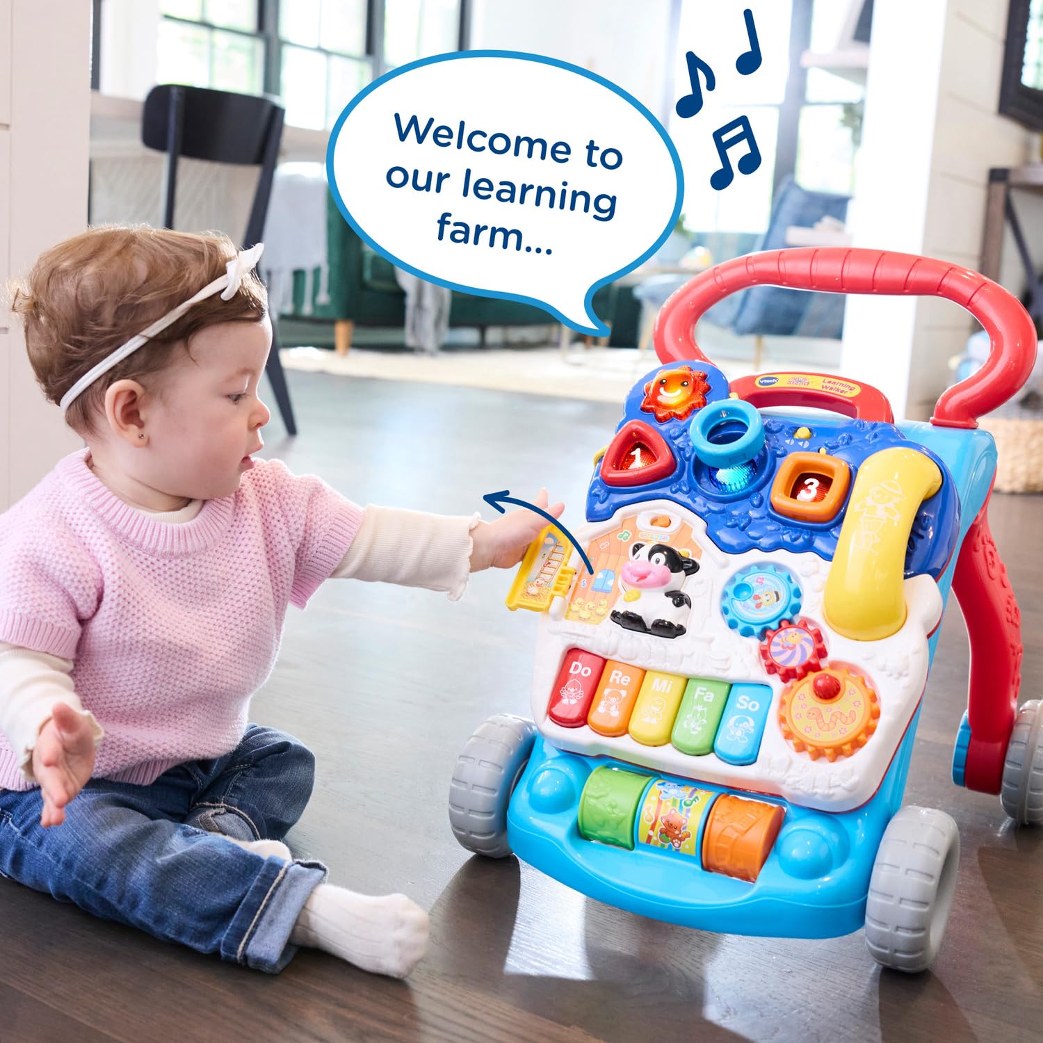 VTech child pushing walker in use showing balance support and walking encouragement