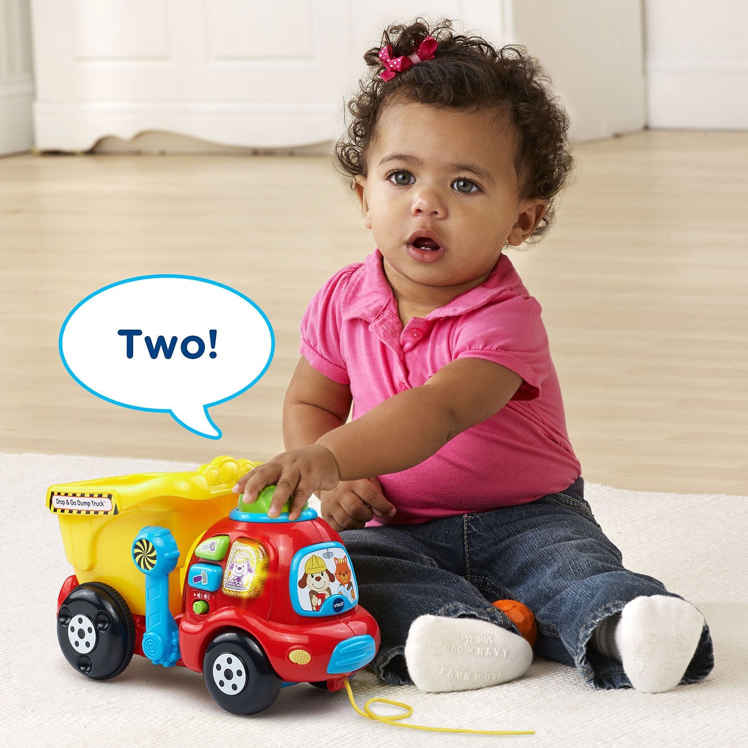 VTech three-button panel showing colors and melodies for early vocabulary