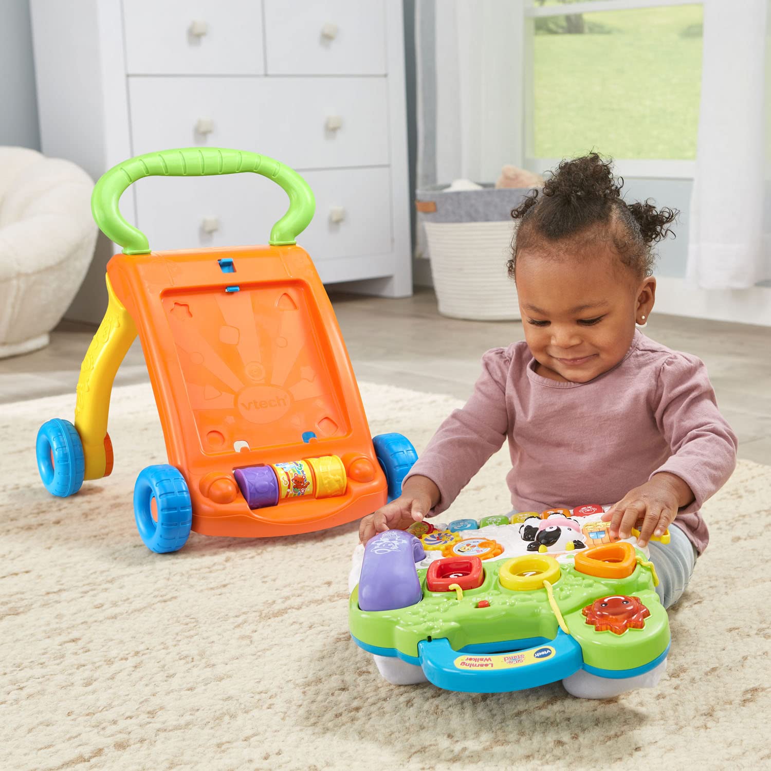 VTech toy handset and light-up buttons promoting pretend play benefit language stimulation