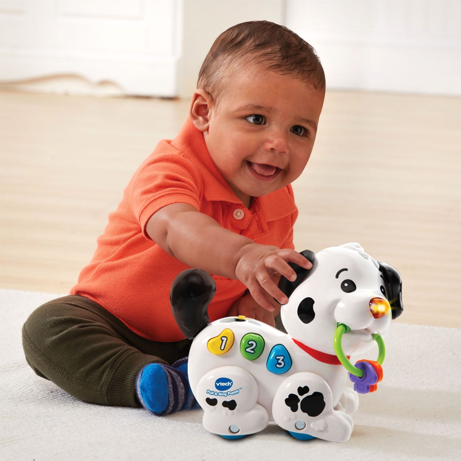 VTech puppy being pulled along floor demonstrating walking encouragement and motion