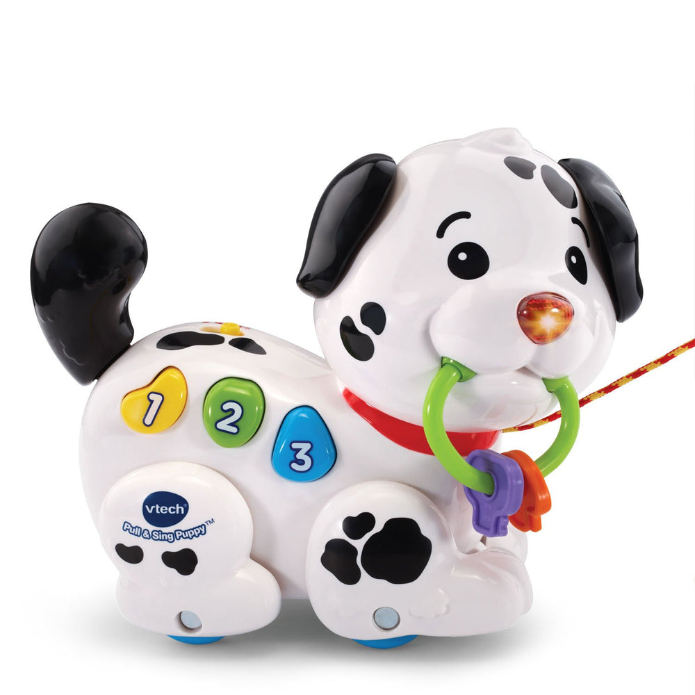 VTech puppy size comparison with toddler hand illustrating compact travel-friendly design
