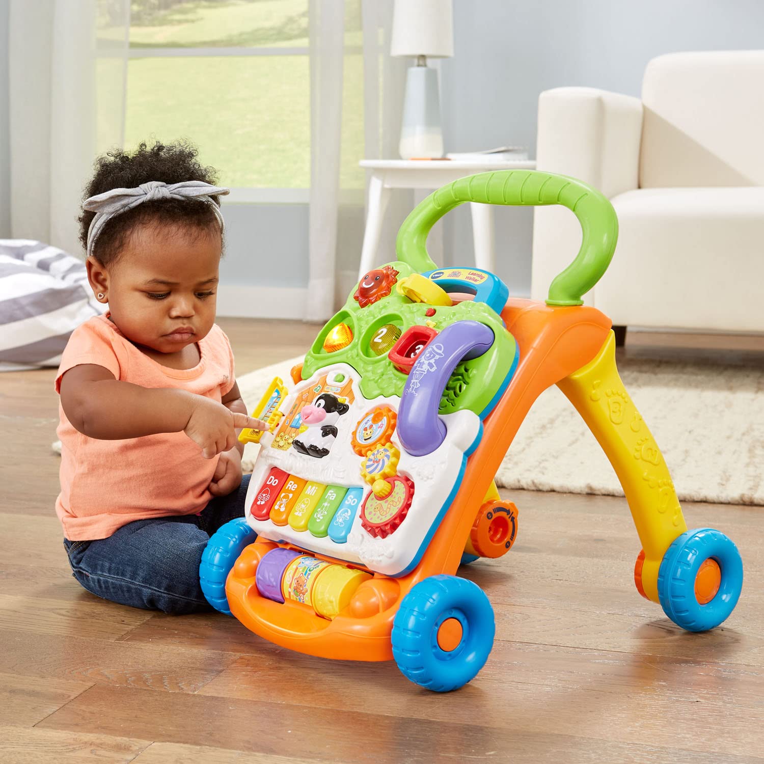 VTech walker next to toy blocks for size comparison benefit easy storage and scale