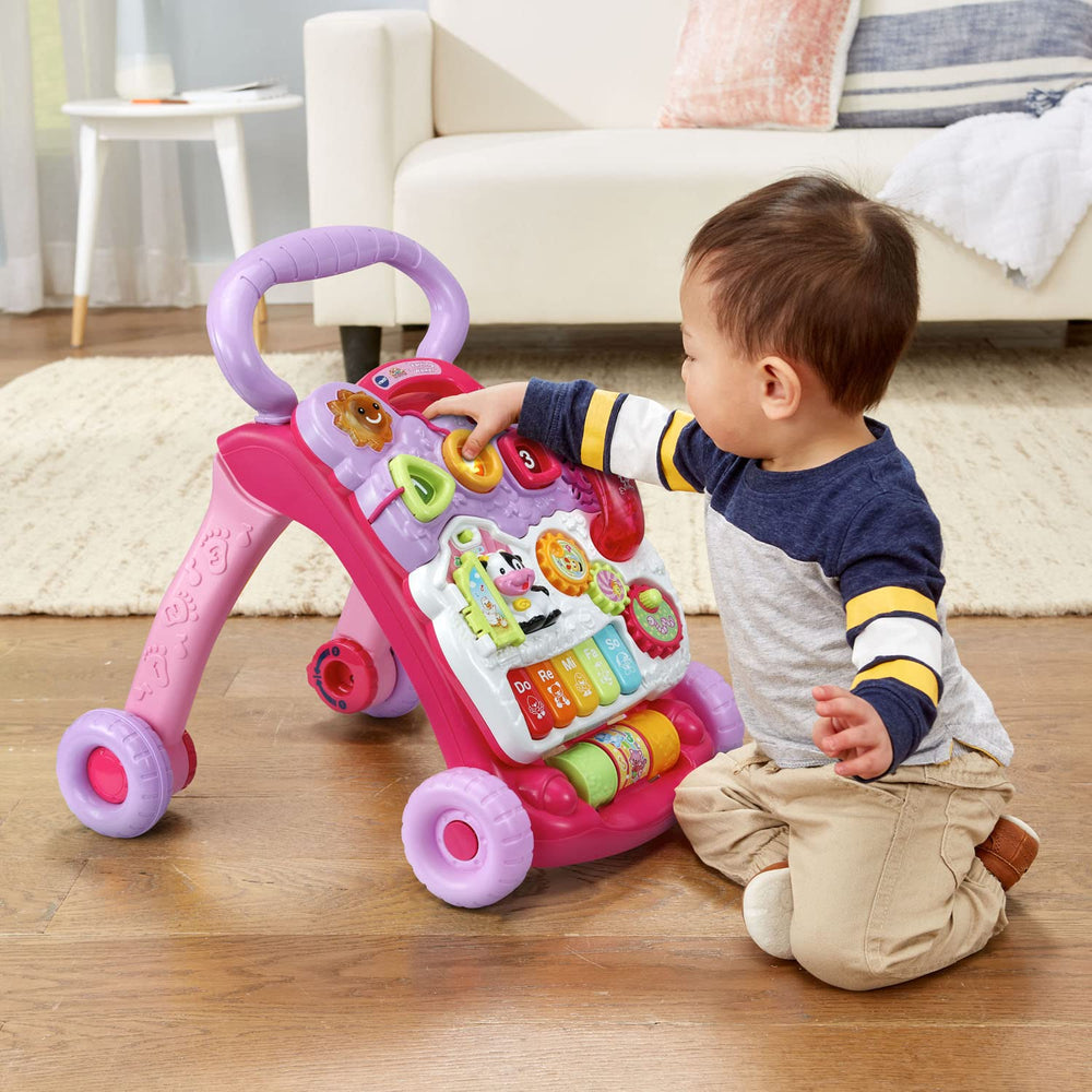 VTech walker beside toy blocks for scale showing compact size and storage ease