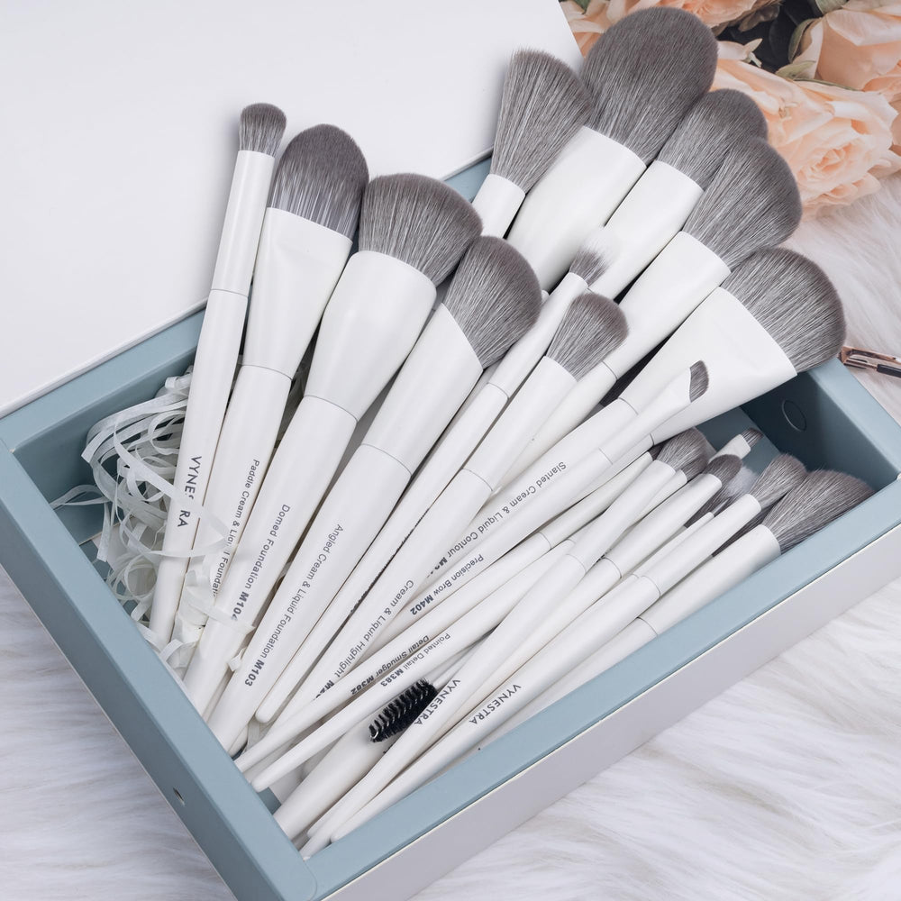 VYNESTRA brush applying foundation for even, streak-free base