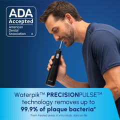 Waterpik Cordless 1100 Precision tip close-up illustrating focused interdental water stream