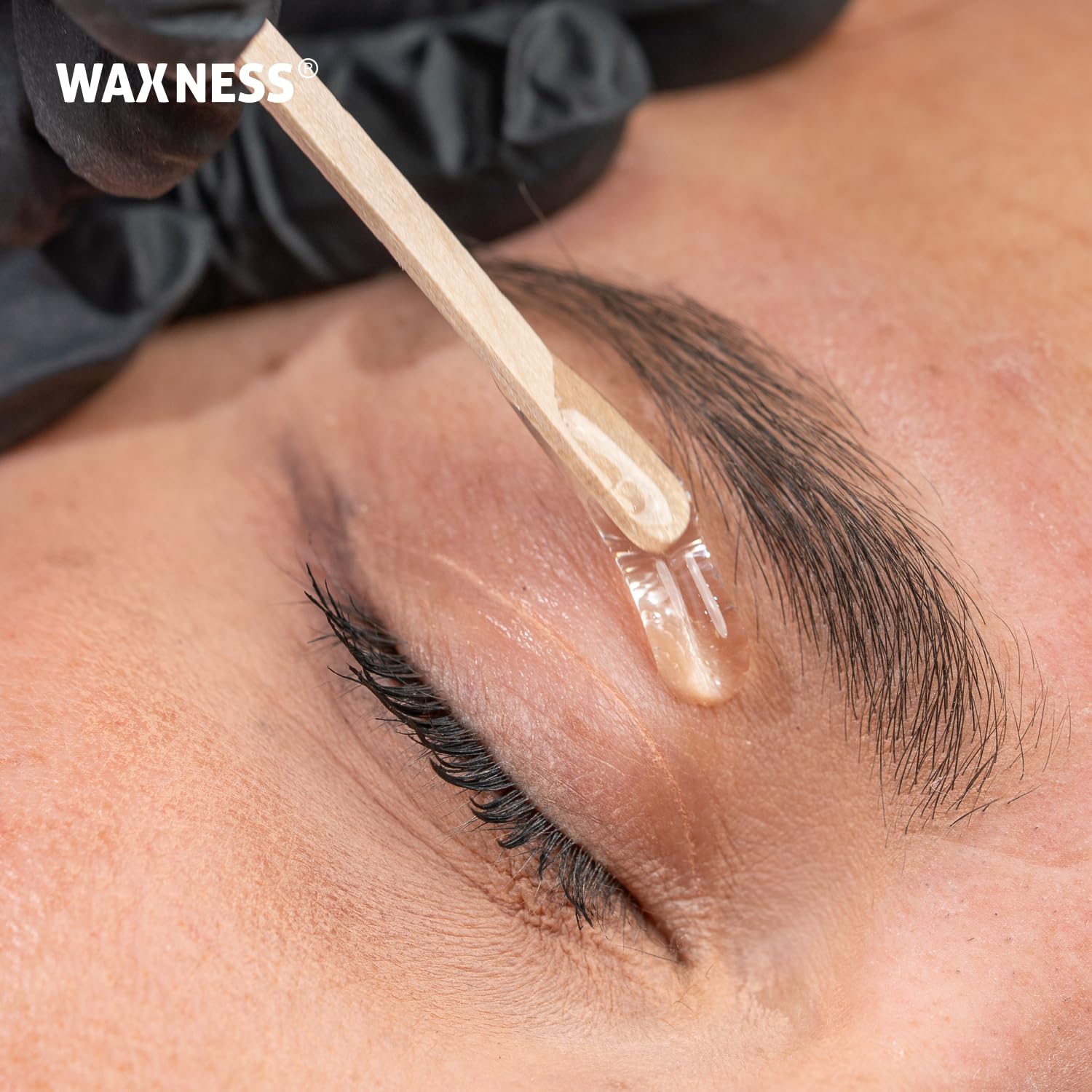 Salon tray with Waxness wax heater and tools in a professional setting