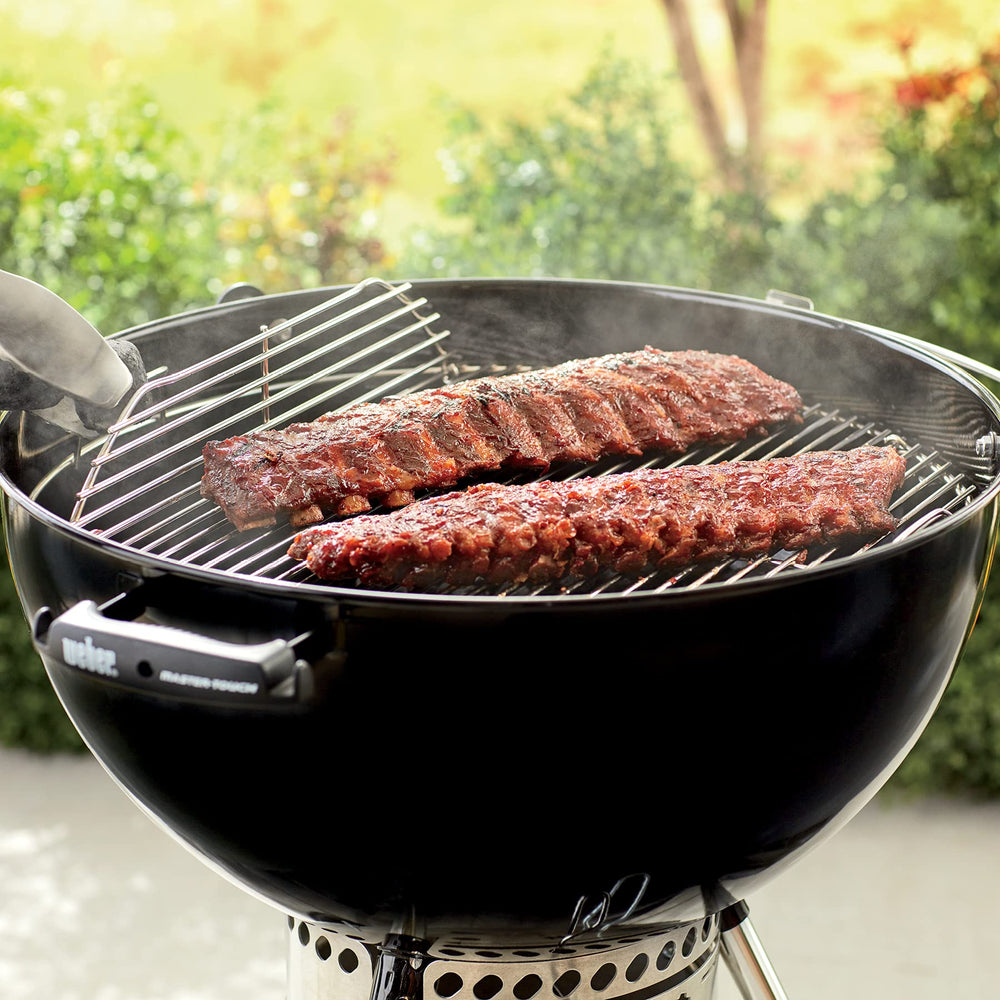 Weber grate with lifted side as charcoal is added for quick fire control