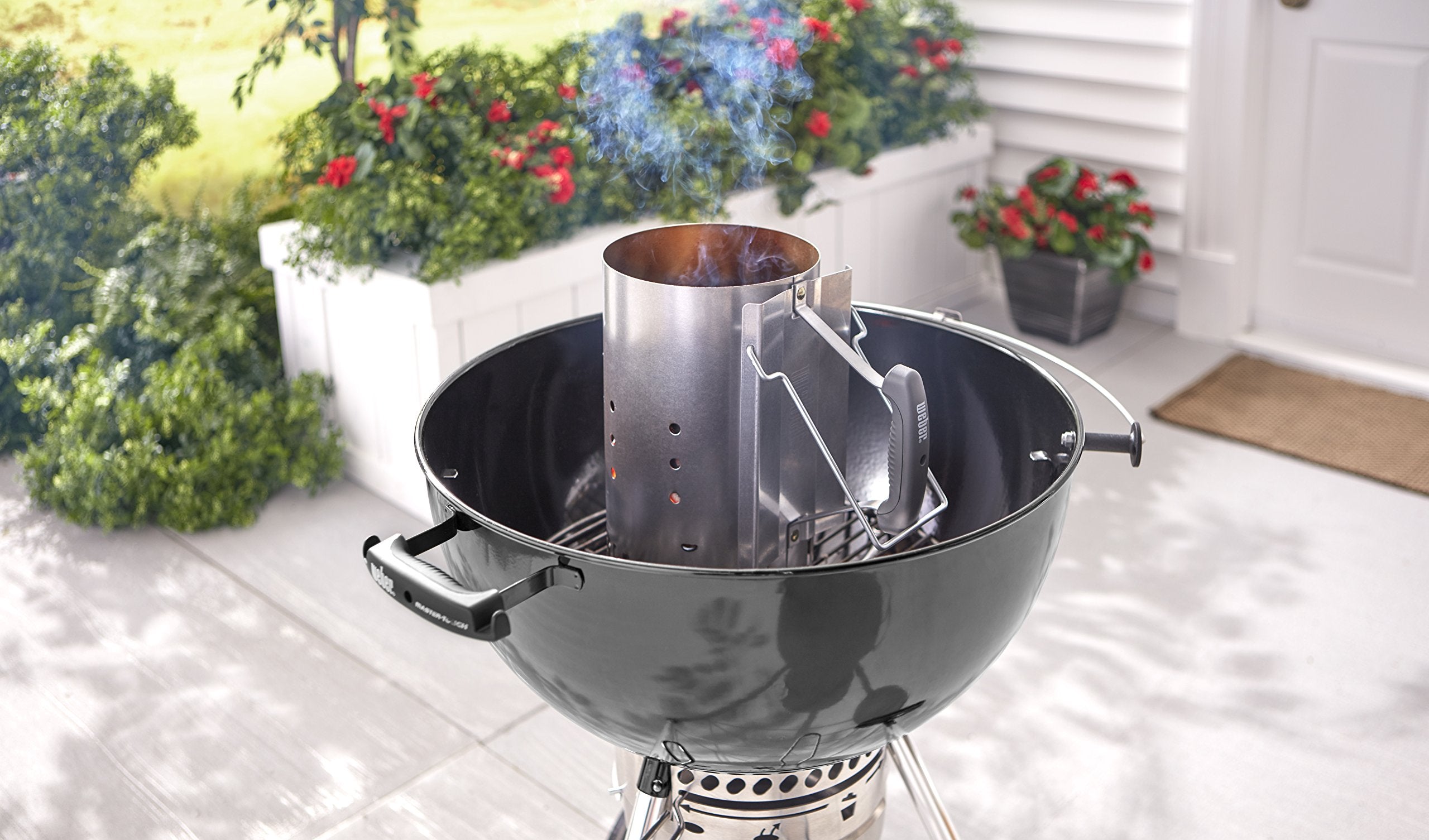 Weber Rapidfire in use with glowing charcoal illustrating fast, even coal ignition advantage