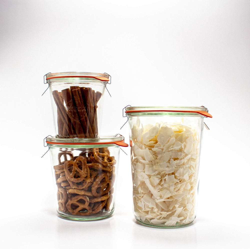 WECK jars stacked on a shelf displaying tidy pantry organization