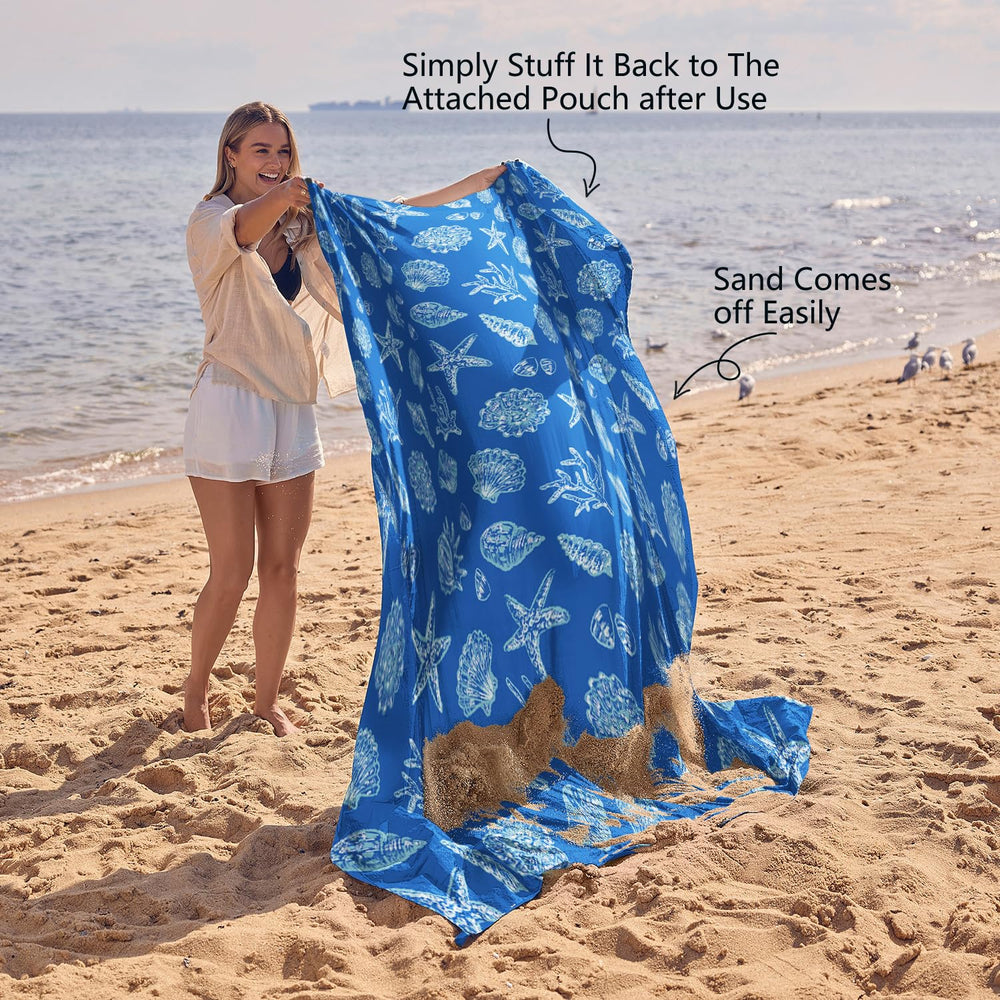 WEKAPO blanket spread on beach with people showing group-comfort benefit