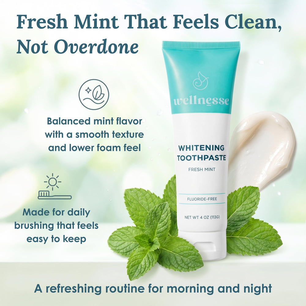 Toothpaste on a manual brush illustrating Wellnesse polishing action for stain reduction