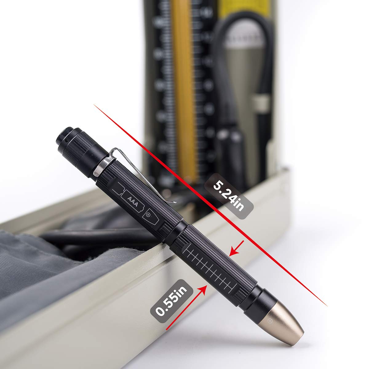 Weltool M6-Dr beside AAA batteries, highlighting simple battery replacement