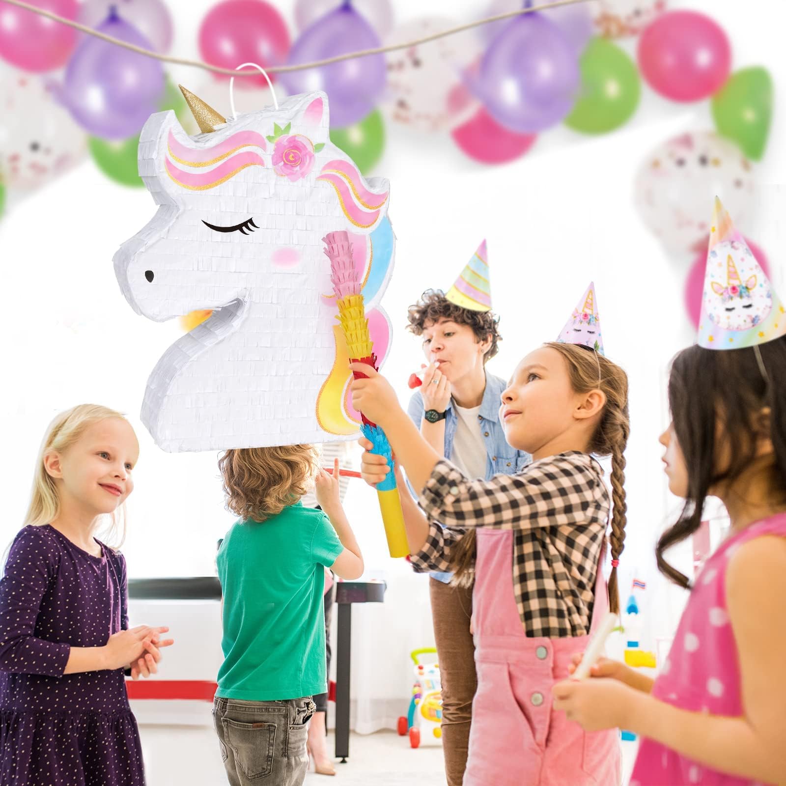 WERNNSAI unicorn piñata next to hand demonstrating compact size and portability